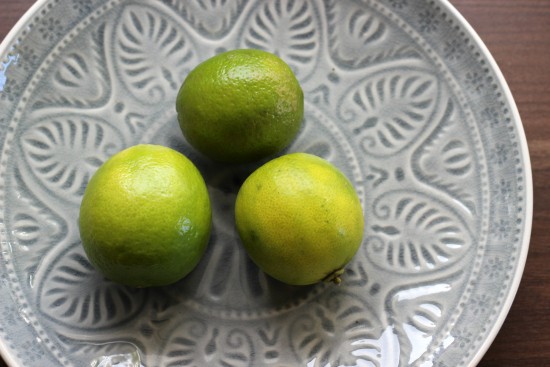 limes on a blue plate
