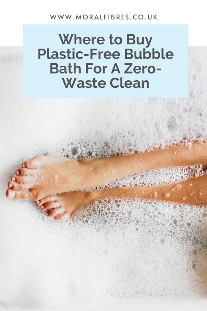 A person's legs in a bubble bath with a blue text box that says where to buy plastic-free bubble bath for a zero-waste clean