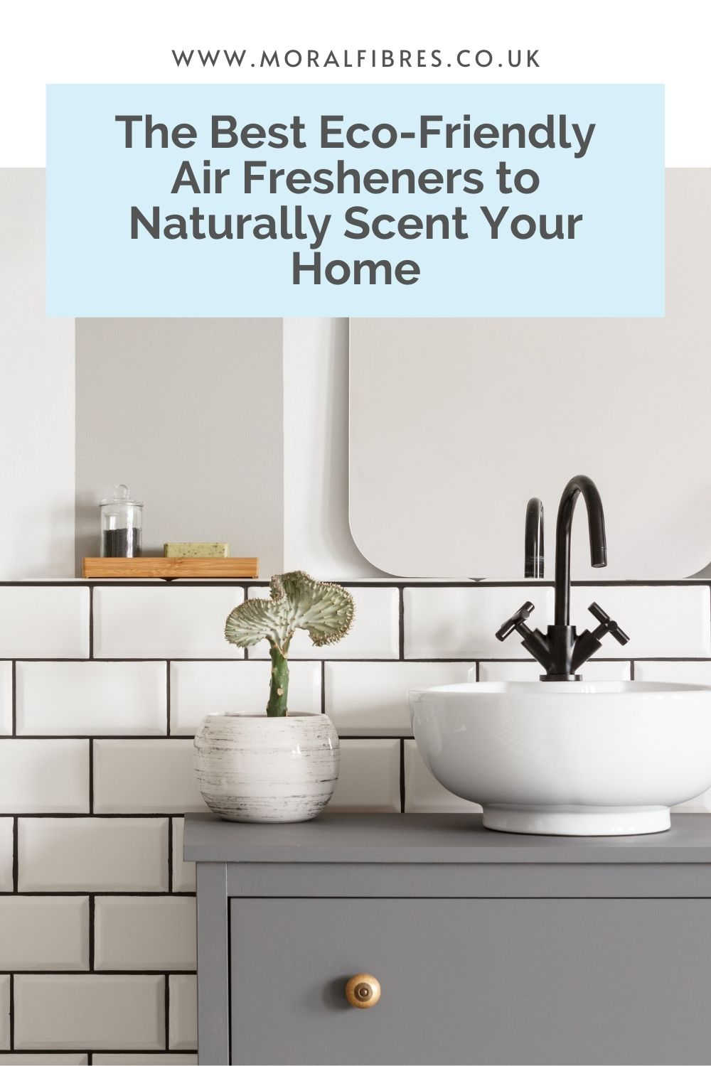 A stylish white bathroom with a blue text box that says the best eco-friendly air fresheners to naturally scent your home.