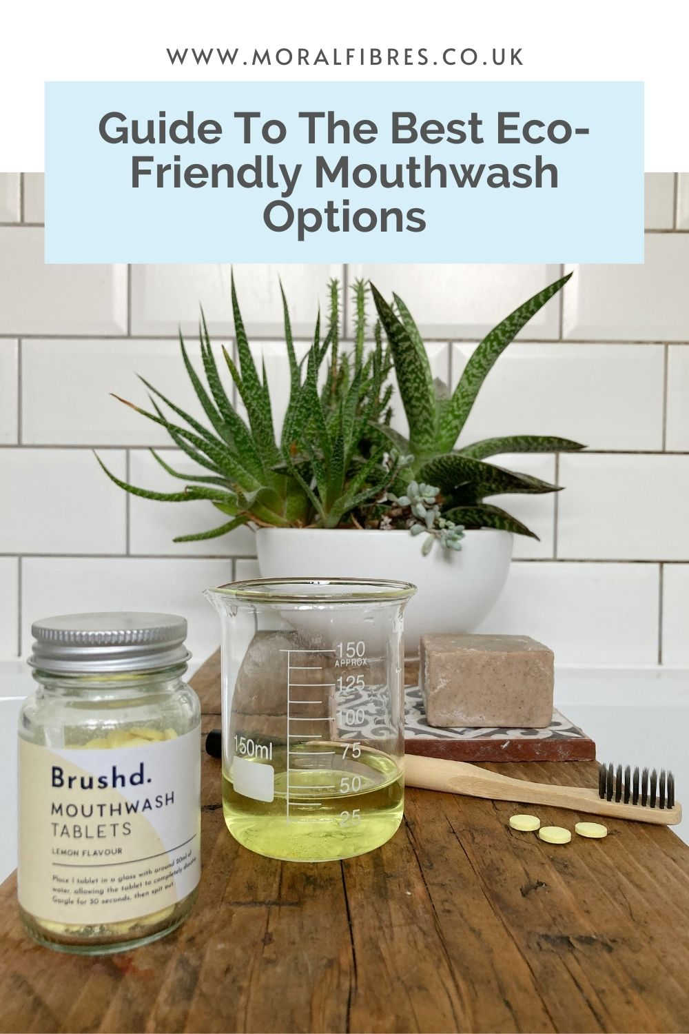 Mouthwash tablets on a wooden surface, with a blue text box that says guide to the best eco-friendly mouthwash options