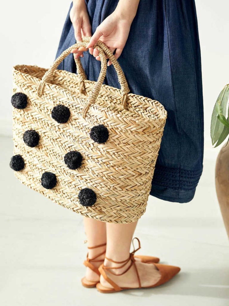 One of Thought's straw sustainable beach bags.