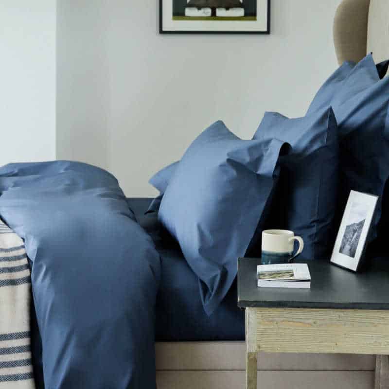 Marquis & Dawe organic cotton bedding in dark blue.