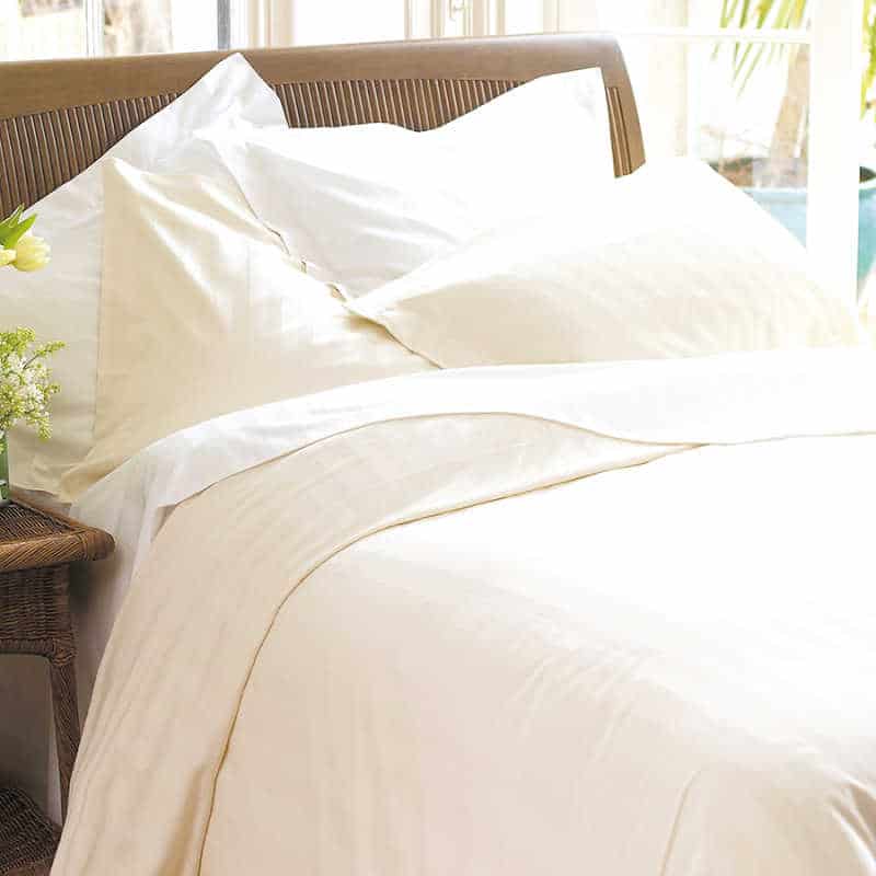 Natural Collection white duvet cover and pillows.