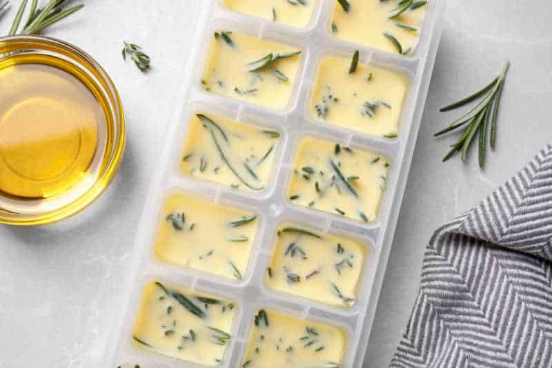 Close up of herbs in ice-cube tray