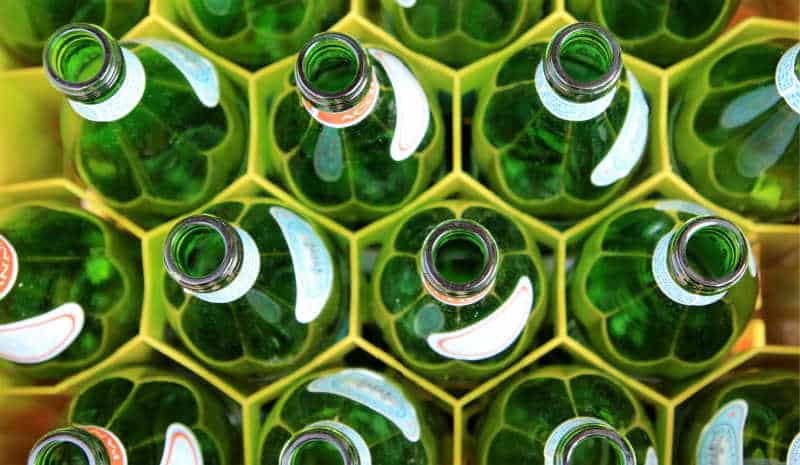 Empty glass bottles ready to be recycled during Recycle Week - an environmental awareness day celebrating recycling.