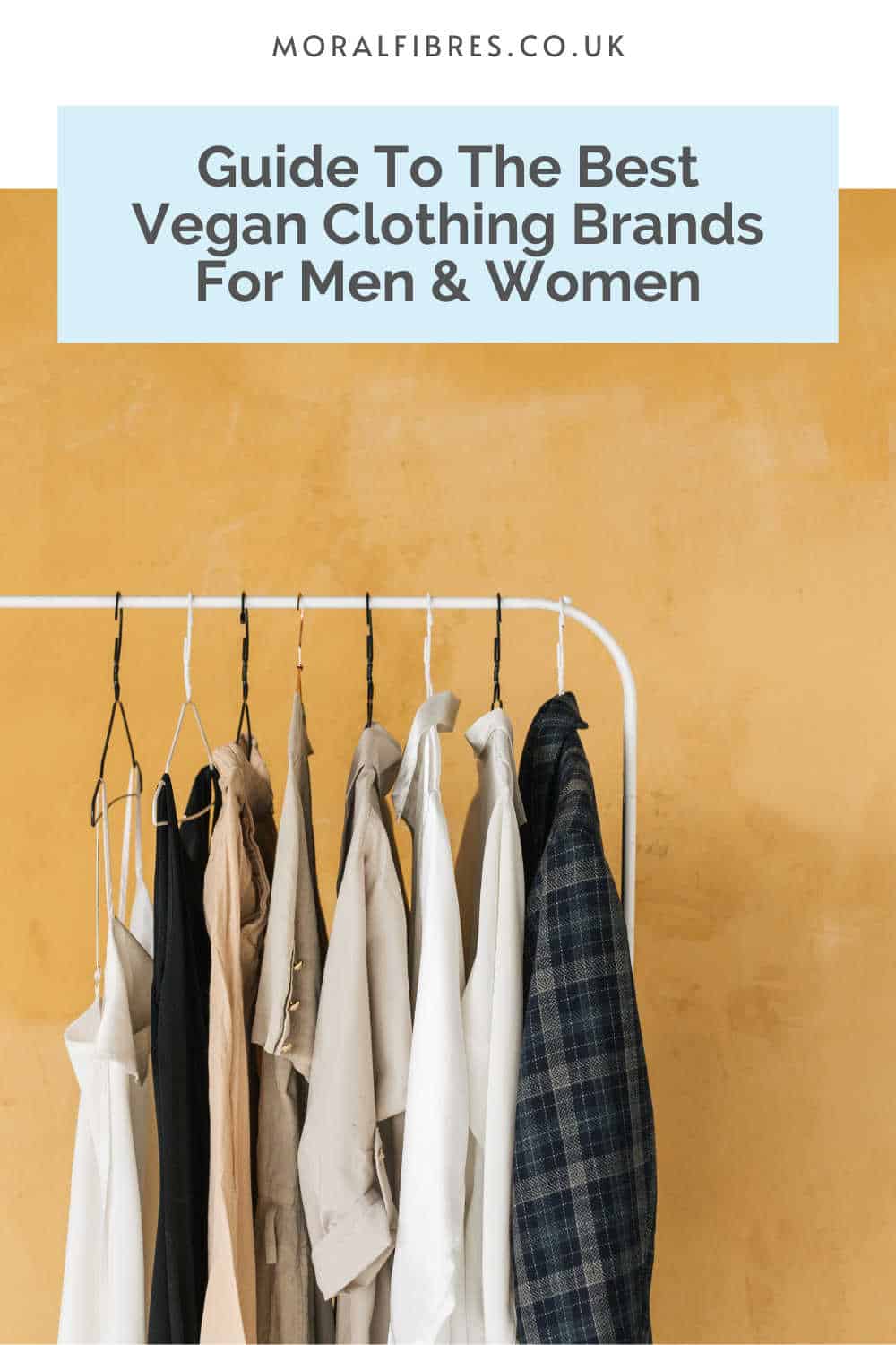 Clothes on a hanging rail with a blue text box that reads guide to the best vegan clothing brands for men and women.