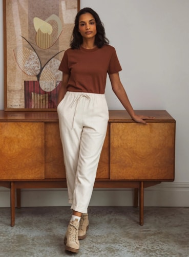 Person wearing cotton trousers from clothing brand Beaumont Organic