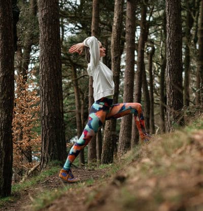 Person wearing BAM bamboo leggings in the woods.