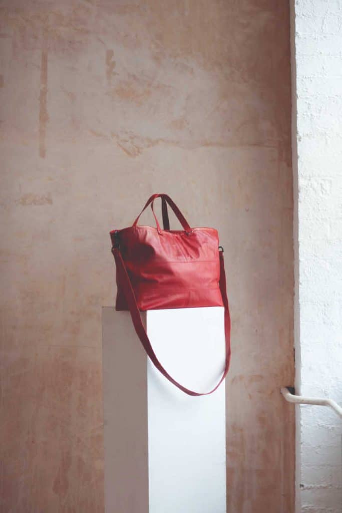 Red tote bag made from upcycled fabrics and materials, by Portia Lawrie