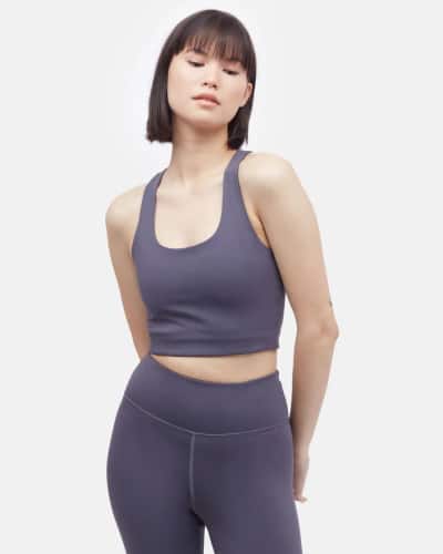 Person wearing a purple sustainable sports bra from Tentree