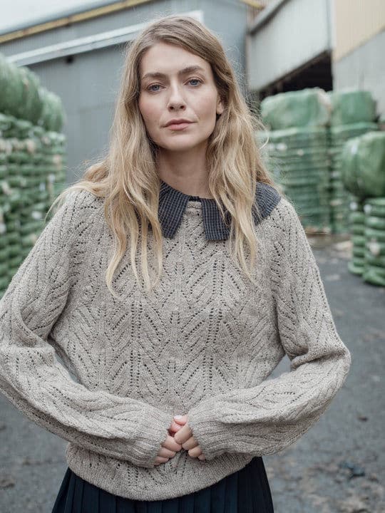 Person wearing a jumper from ethical and eco-friendly knitwear brand Herd