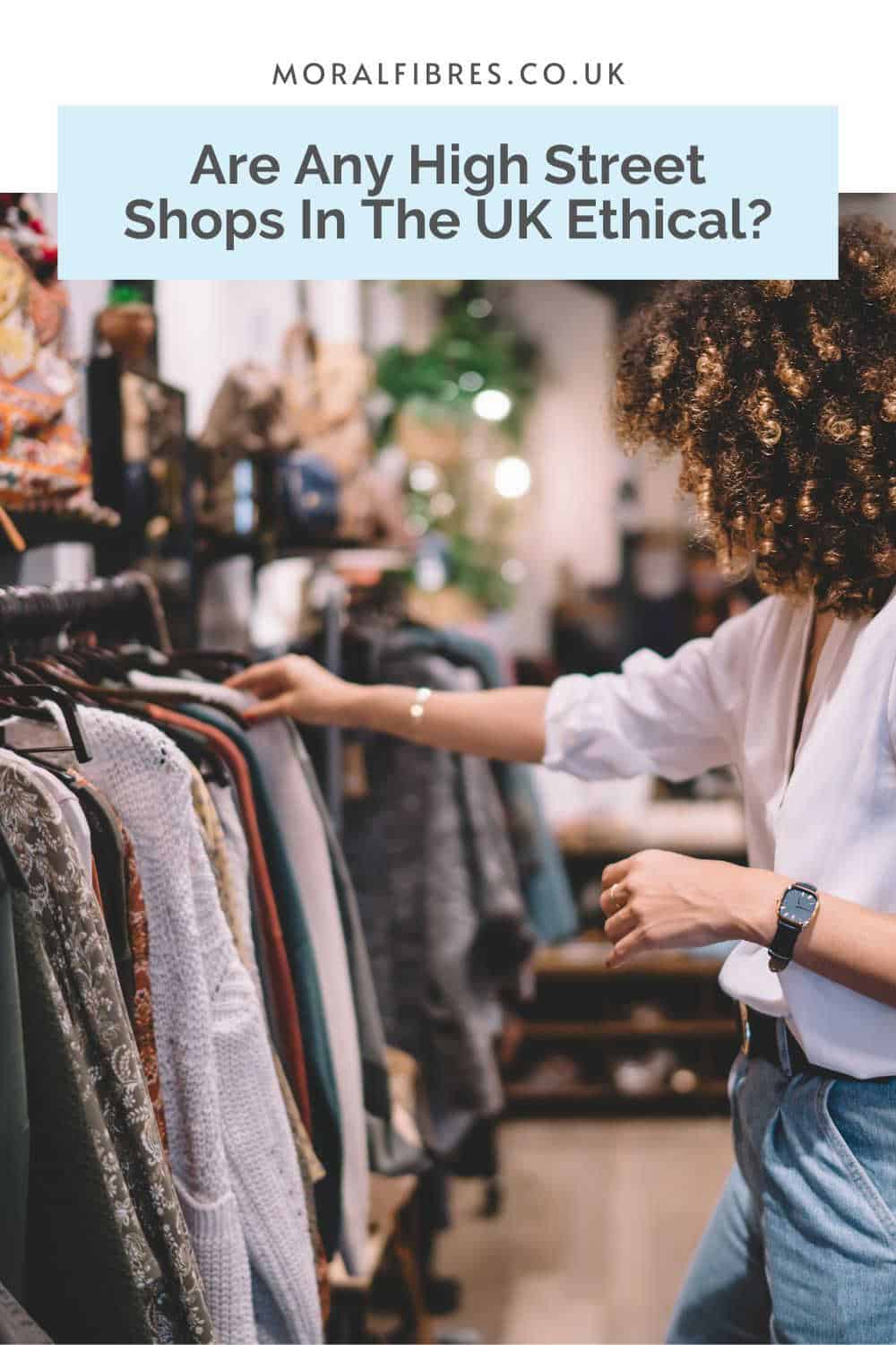 Curly haired person browsing clothes in a store with a blue text box that reads are any high street shops in the UK ethical?