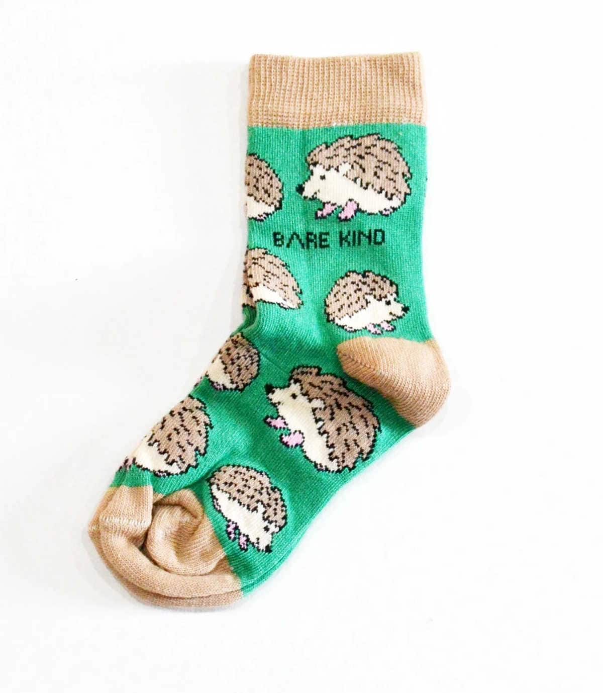 Green socks with brown hedgehogs on them