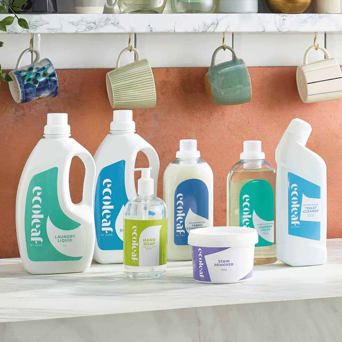Selection of Eco-leaf eco-friendly cleaning products on a marble kitchen counter.