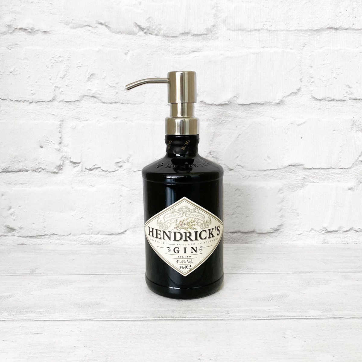 Hendricks gin bottle upcycled into a liquid soap dispenser