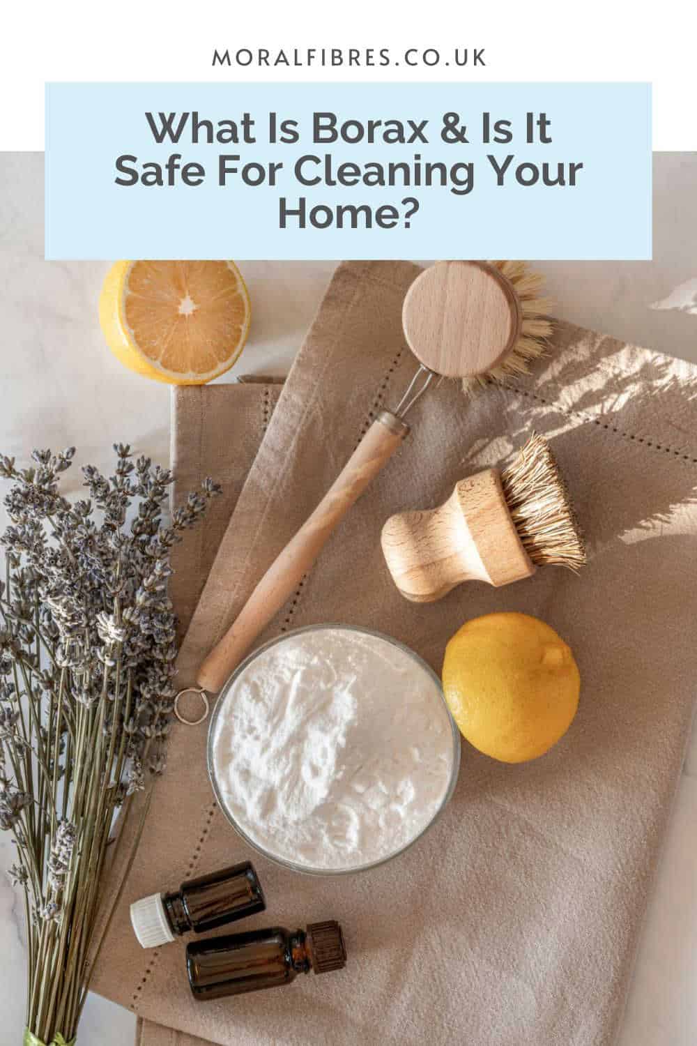 Natural cleaning ingredients laid out on a beige tea towel with a blue text box that reads what is borax and is it safe for cleaning your home?
