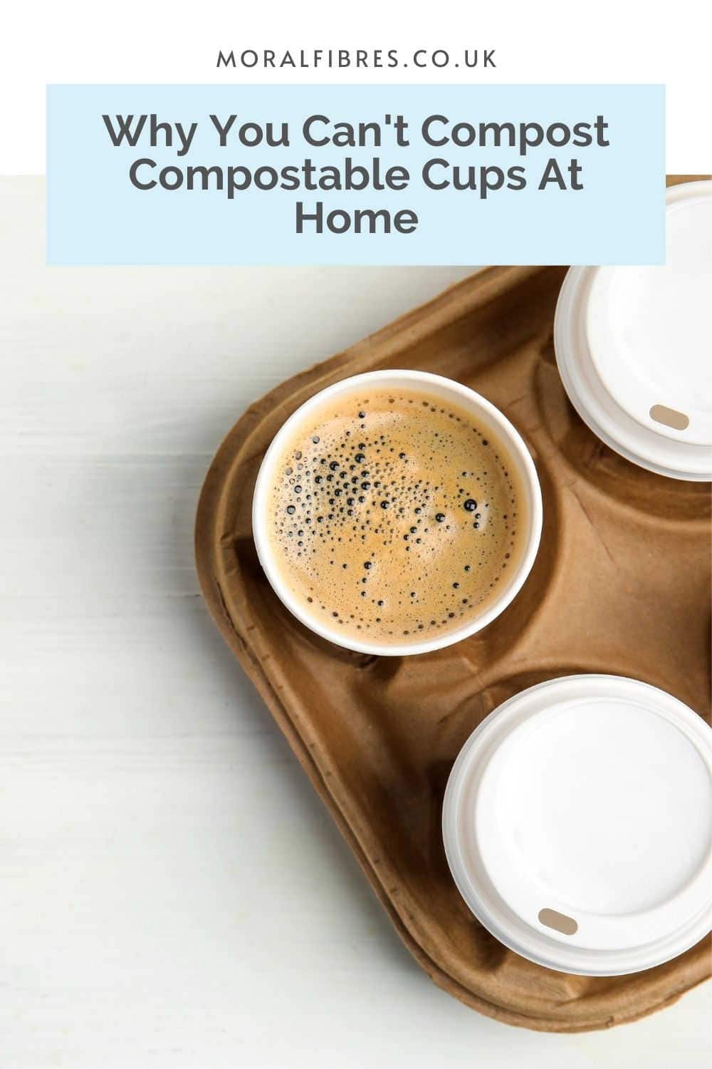 Three takeaway coffee cups on a tray, with a blue text box that reads why you can't compost compostable cups at home.