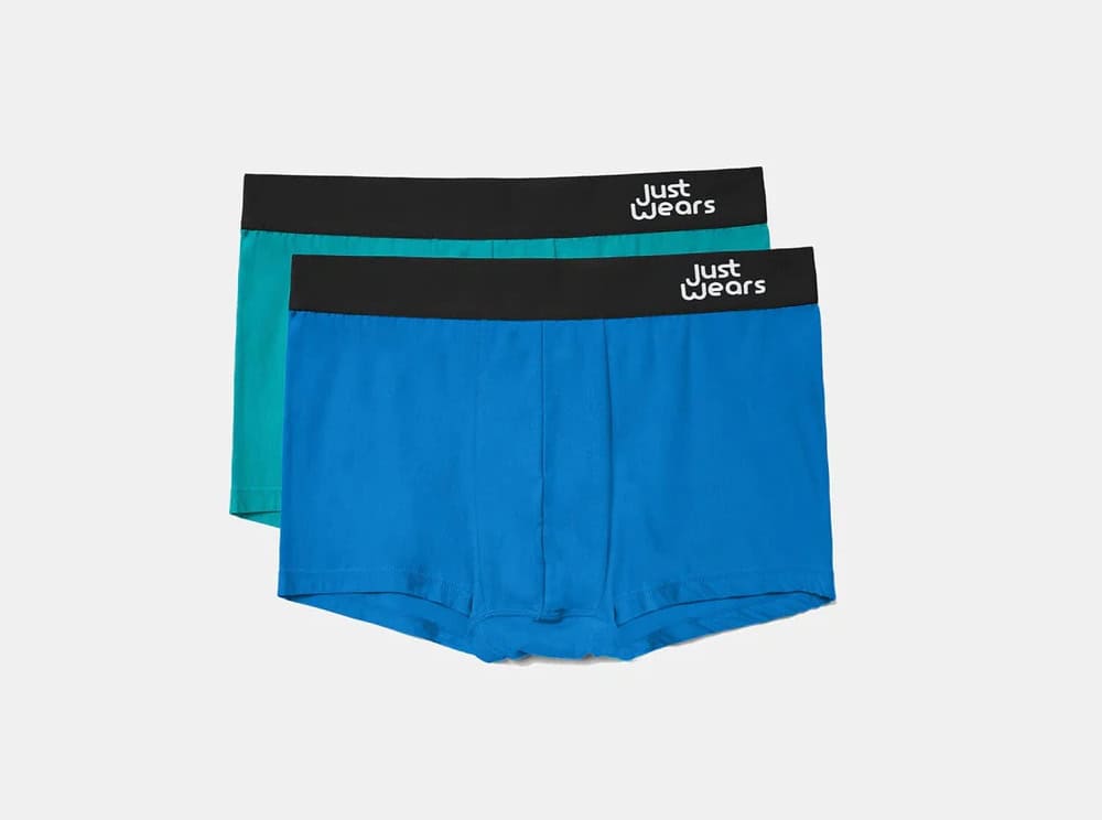 Blue and green pairs of boxer shorts from sustainable brand JustWears.