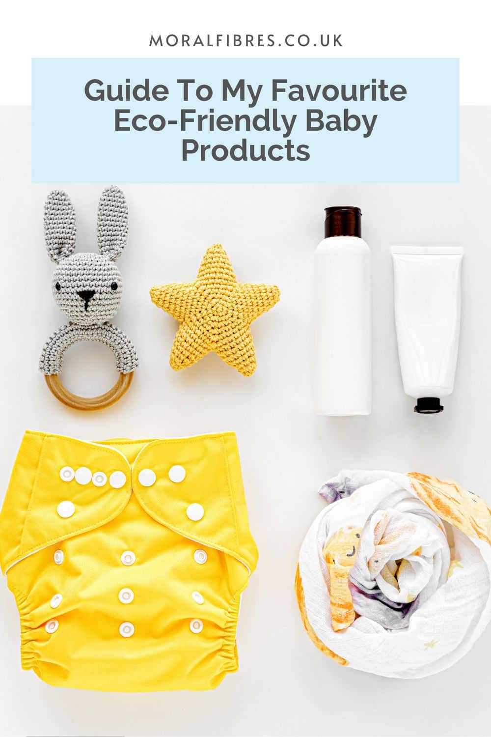 A reusable nappy, a cloth muslin, some crochet baby toys and some lotion tubes, with a blue text box that reads guide to my favourite eco-friendly baby products.